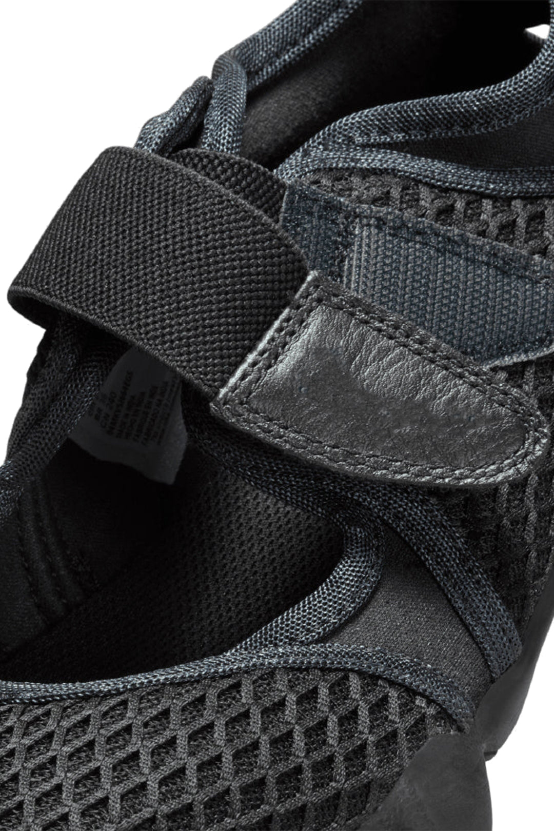 Close-up of a black and gray shoe with mesh design